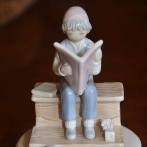 FLAVIA Porcelain Figurine Child Reading on Bench
